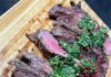 Butter seared New Zealand ribeye steak topped with Chimichurri sauce Butter seared New Zealand ribeye steak topped with Chimichurri sauce