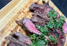 Butter seared New Zealand ribeye steak topped with Chimichurri sauce Butter seared New Zealand ribeye steak topped with Chimichurri sauce